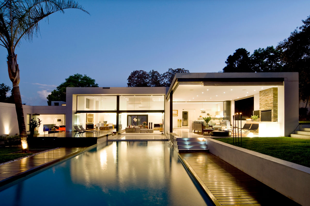 Back of a beautiful house with large living area and dedicated lighting