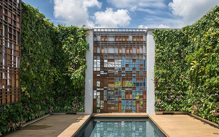 Green frame around the pool makes both indoor and outdoor enjoyable