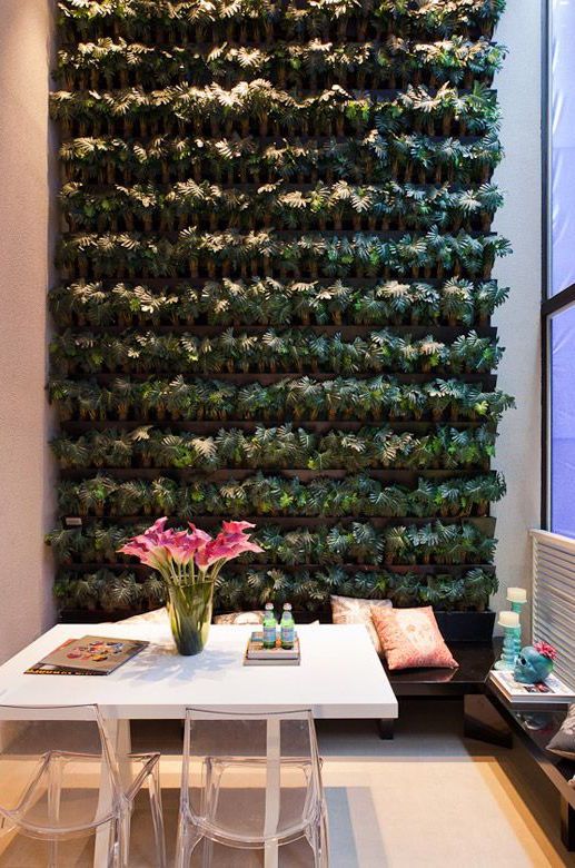 High-ceilinged balcony has been enhanced with the vertical garden