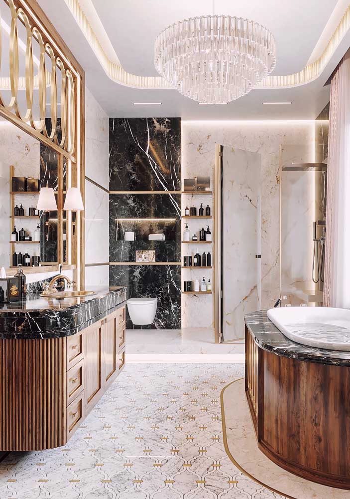 The crystal chandelier is just one of the elements that put this bathroom in the luxury category