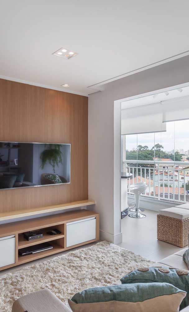 Small apartment living room integrated with balcony to gain amplitude