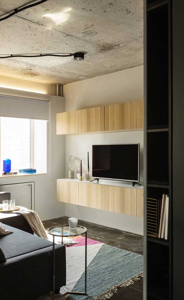 The industrial feel of this small living room was the ceiling and the burnt cement floor