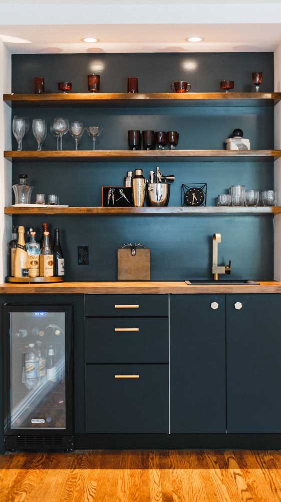 Not everything needs to be exposed in the home bar.  Put only the labels you like best on the shelves, plus a few glasses