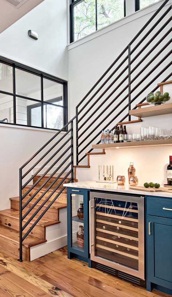 Take advantage of the space under the stairs to set up your home bar.