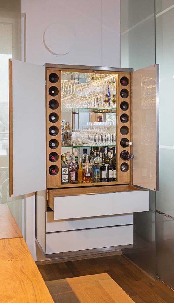 A cabinet with doors and drawers for the home bar.  Closed, he doesn't even show up!