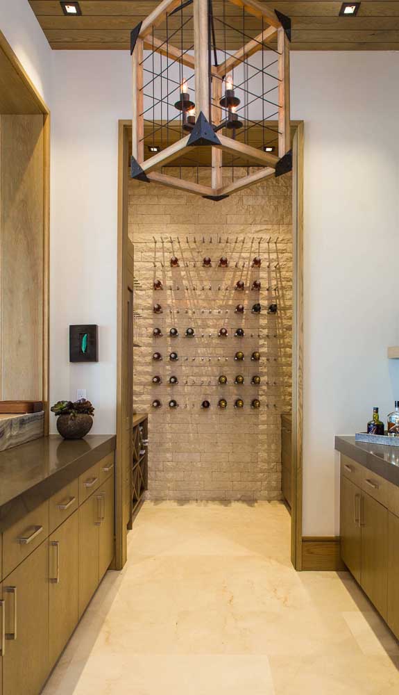 At the end of the kitchen, a well-equipped home bar awaits visitors