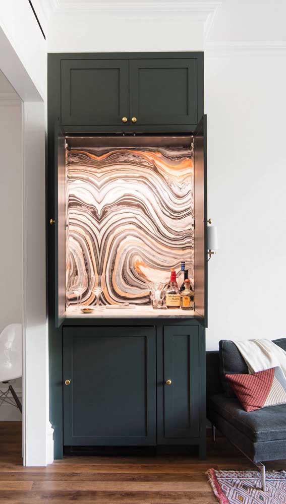 The distinctive painting inside the home bar cabinet is the highlight here