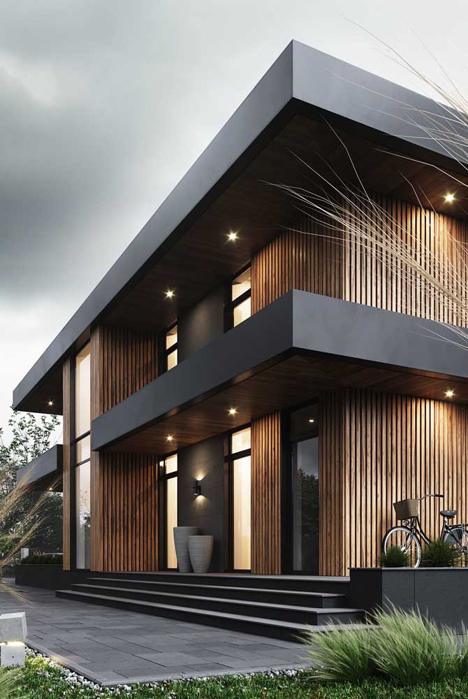 Casa de madeira linda com iluminação externa.