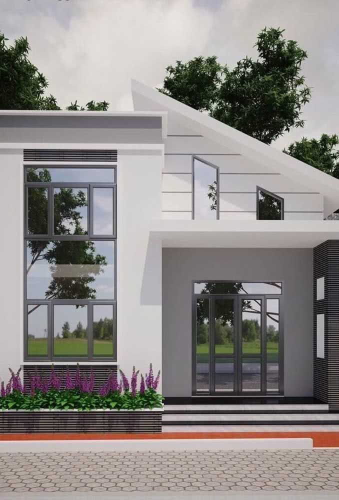 Projeto de sobrado branco com janelas e portas metálicas na cor cinza.