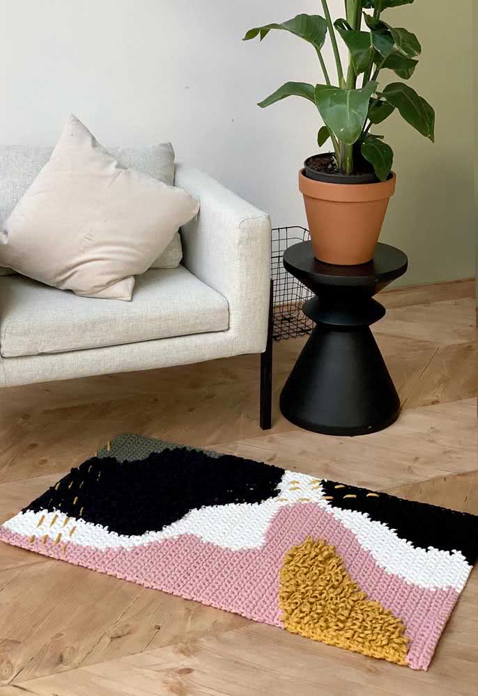 Tapete de crochê retangular com variedade de cores e texturas
