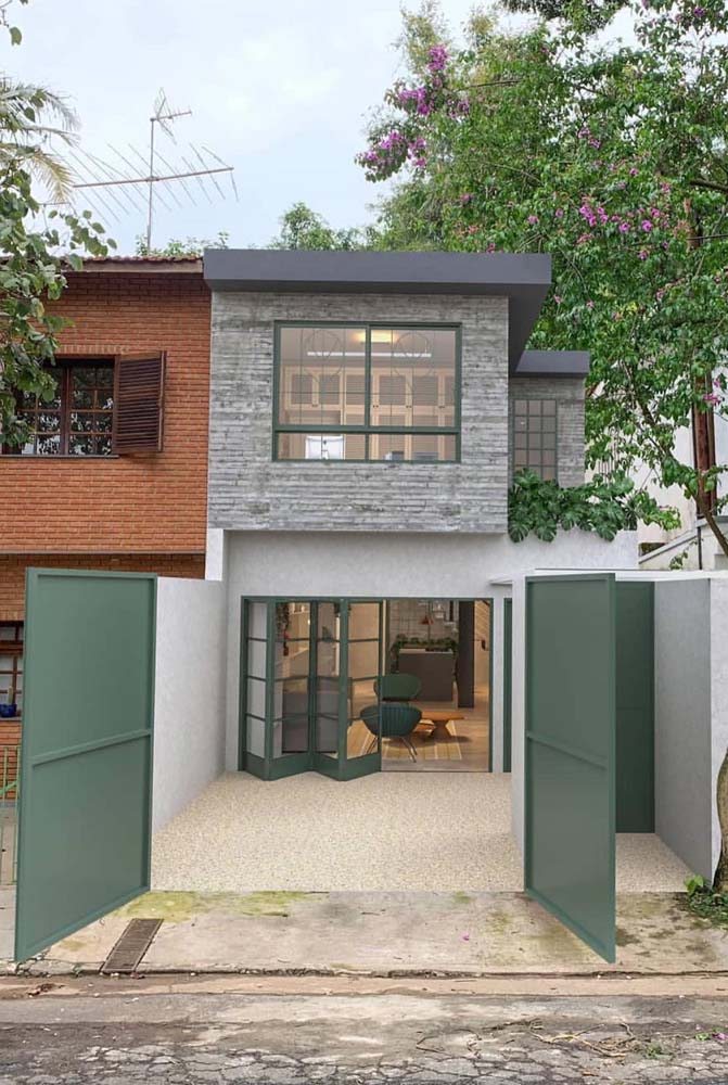 O verde entra em todos os detalhes dessa fachada de casa simples e moderna